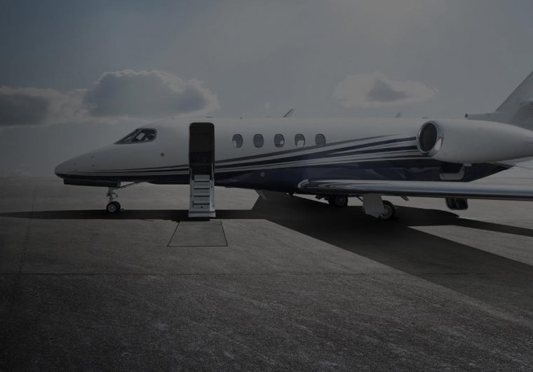 A private airplane on an airstrip in a background image for Nexgen